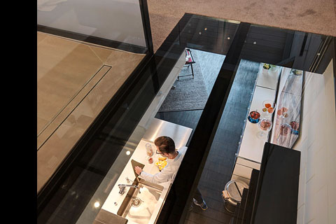 view from above, man standing in kitchen