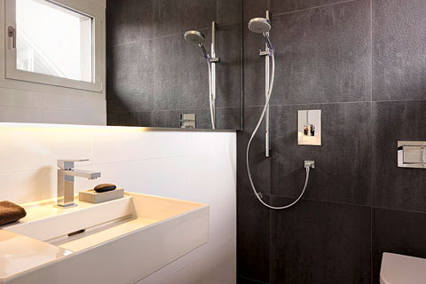 bathroom, modern white washbasin, granite shower area