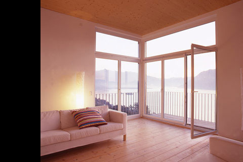 living room with view on balcony and lake