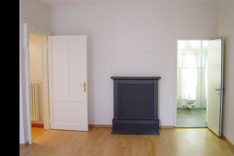 living room with dark wood burning stove